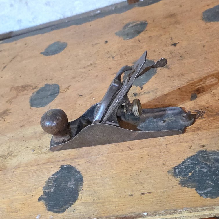 Early Metal Bench Plane With Wood Front Knob, Corrugated Sole, Adjustable Iron, and Brass Knob