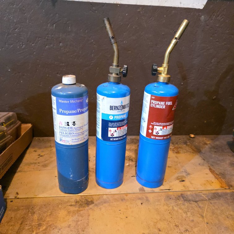 (3) Partial Propane Cylinders Including Bernzomatic, Master Mechanic, and Propane Fuel Cylinder With Torches