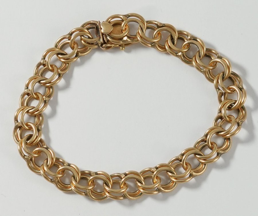 14K yellow gold charm bracelet with safety 8