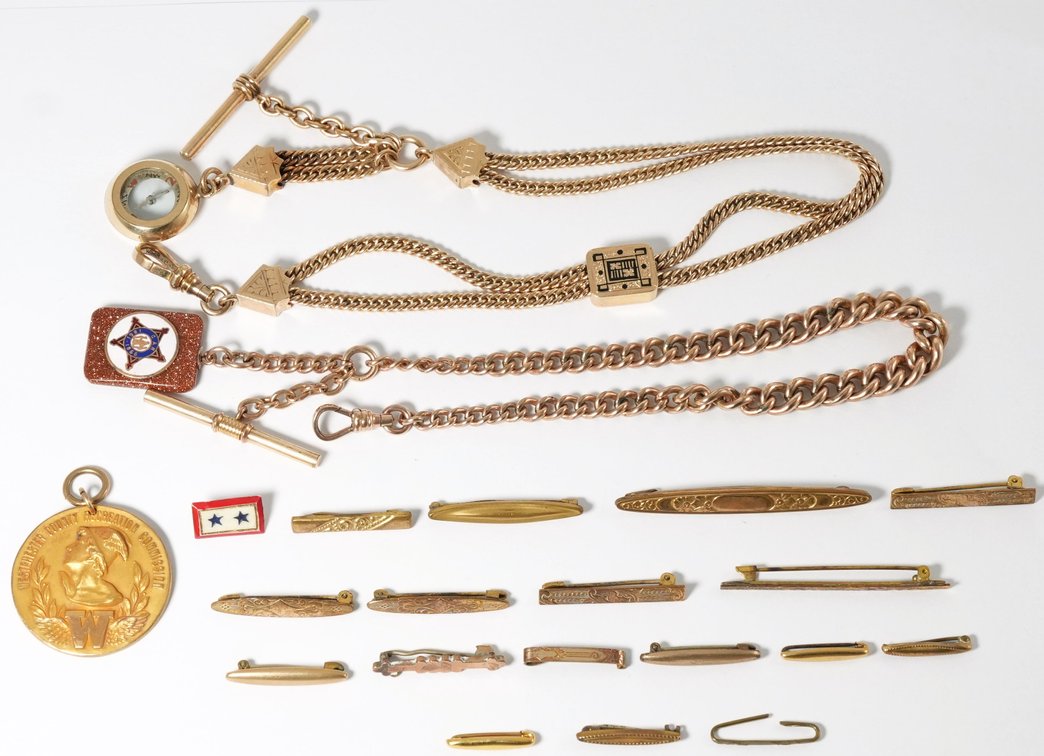 Jewelry lot (21) Assorted gold-filled chains, pins, and medal