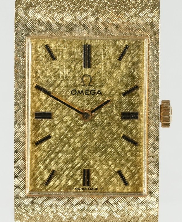 Omega, manual wind in 14K w/boxes