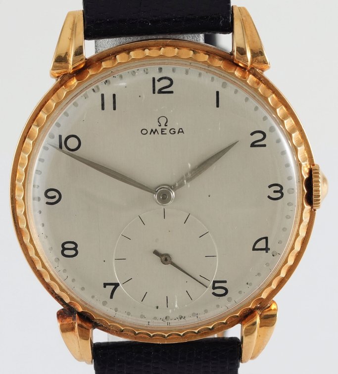 Omega, manual wind in 18K