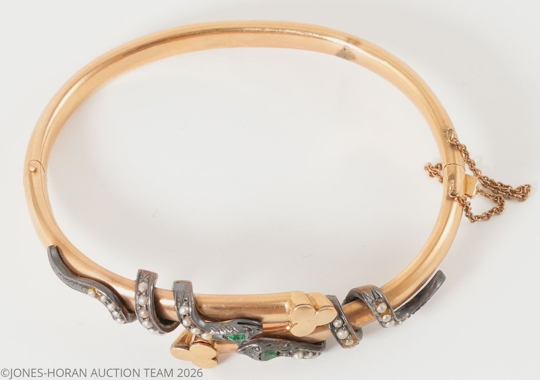 18K yellow gold bangle bracelet with sterling silver snake wrapped around the top