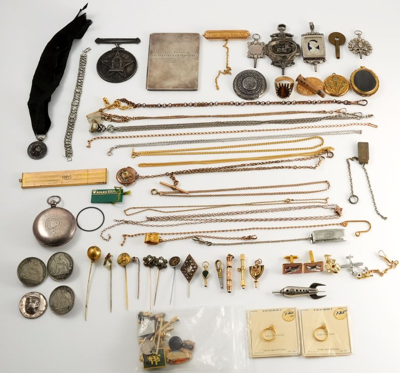 Diverse lot of assorted jewelry, chains, fobs, silver items, and more