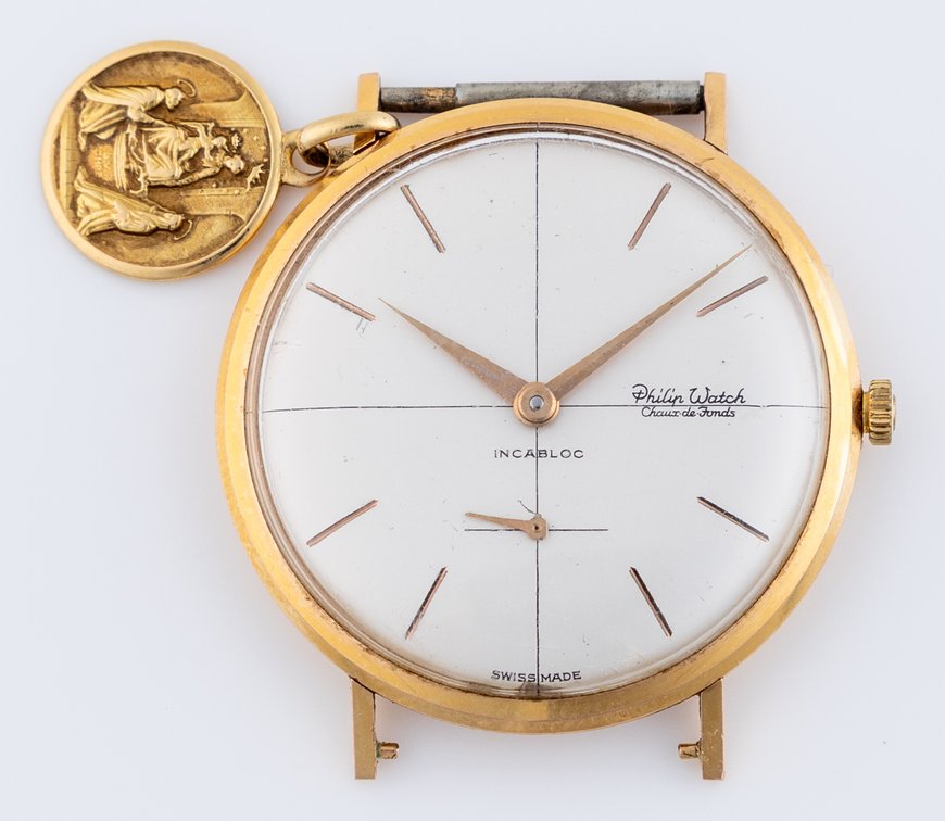 Philip Watch manual wind in 18K w/Ave Maria medallion