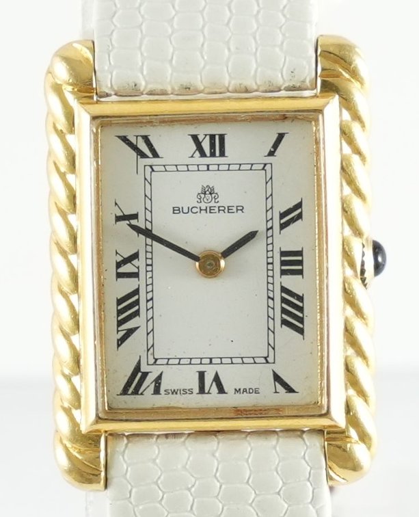 Lady's Bucherer tank, manual wind in 18K