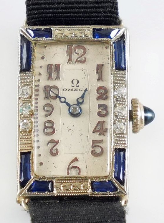 Lady's Milex diamond & sapphire cocktail watch in 18K
