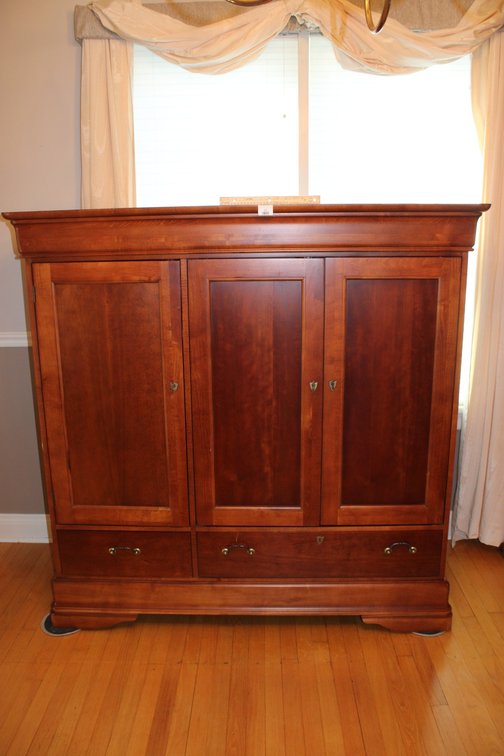 Cherry Wood Veneer Media Cabinet. Measures 60.5 x 22 x 59.5