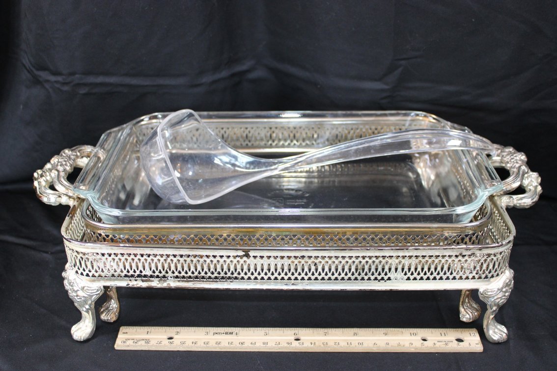 Two Casserole Servers, A Casserole, And A Plastic Ladle