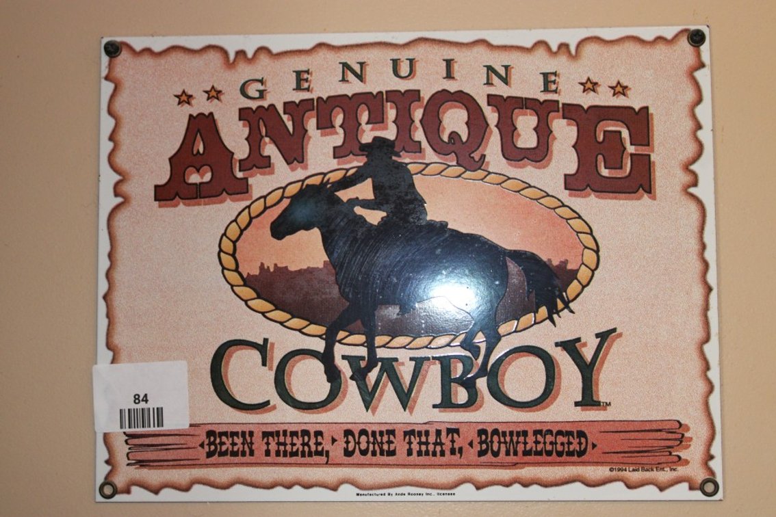 Reproduction, Porcelain, Enameled, Antique Cowboy Sign. Measures 11.5 x 8.5.