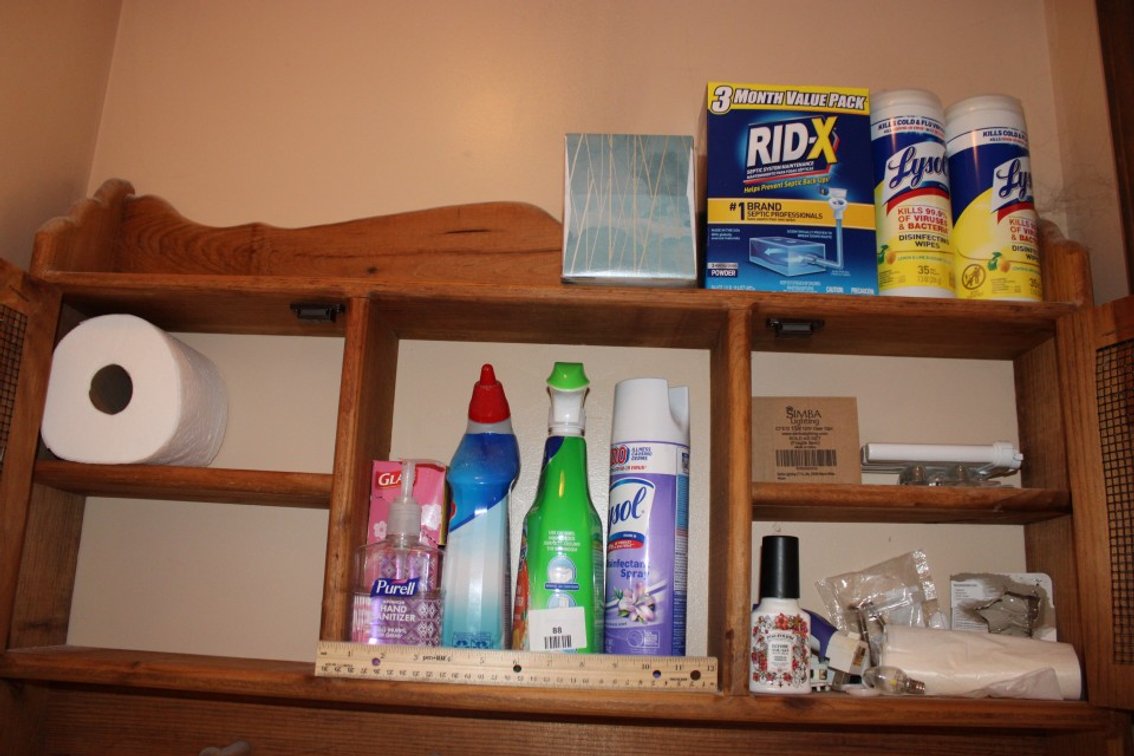 Contents Of Bathroom Cabinet Mostly Cleaning Supplies.