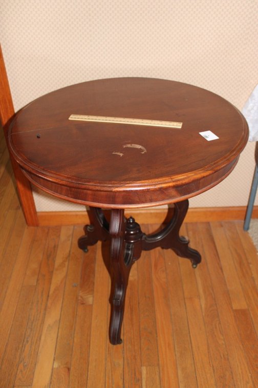 Victorian Parlor Table Features Casters. Condition