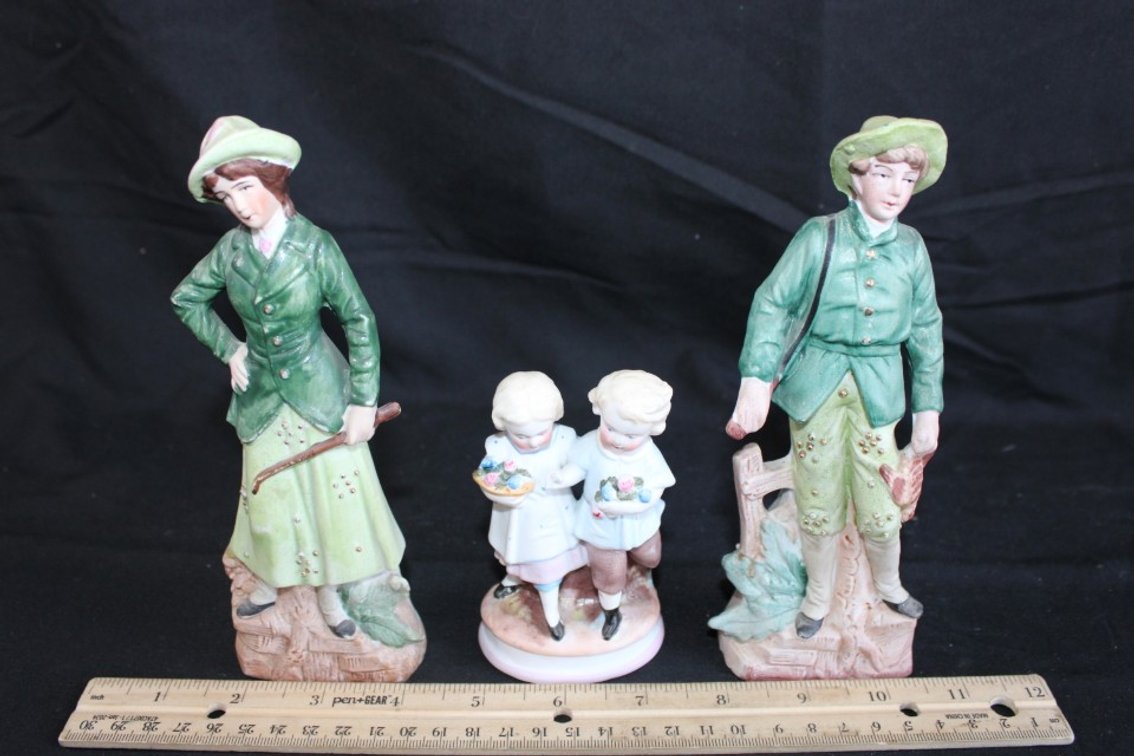 Mom, Dad, And Kid Figurines.