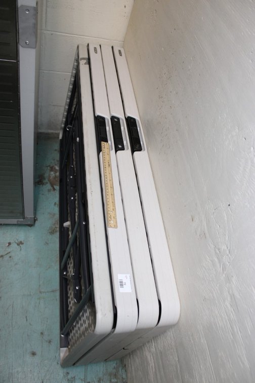 Four 4 Foot Folding Tables.