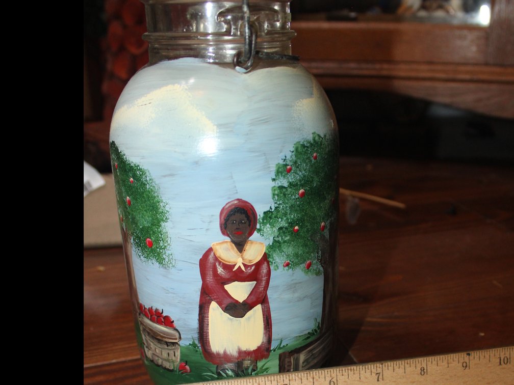 Hand Painted Black Americana, Atlas E-Z Seal Jar With Lid, Depicting An Apple Orchard Scene With A Woman Picking Apples, Approximately 9 Inches Tall