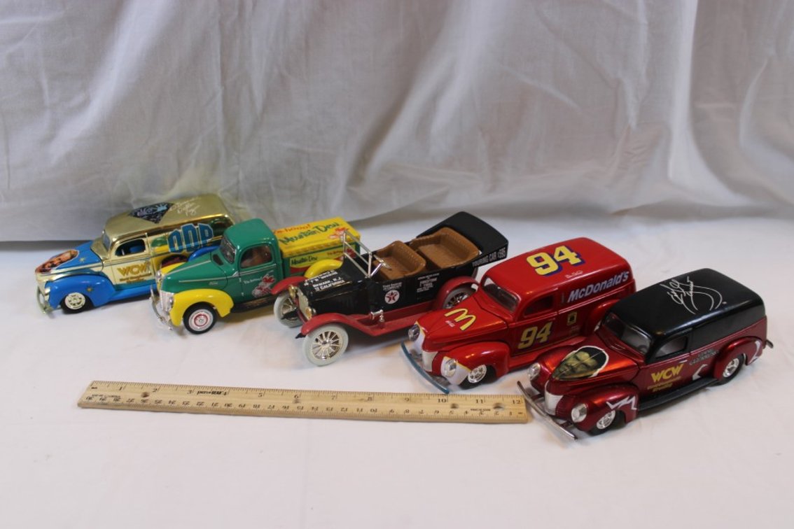 Four 1:24 Scale Diecast Cars, Three Winner's Circle Coupes, and a Ertl 1917 Touring Car