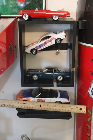 Image for Four Diecast Cars and Display Shelves. Three Are 1:32 Scale, One Is 1:24 Scale. Signature 1961 Chevy Impala, New Way 1970 Dodge Challenger, Signature 1963 Studebaker Missing a Wheel, and 2004 Thunderbird Fighting Illini