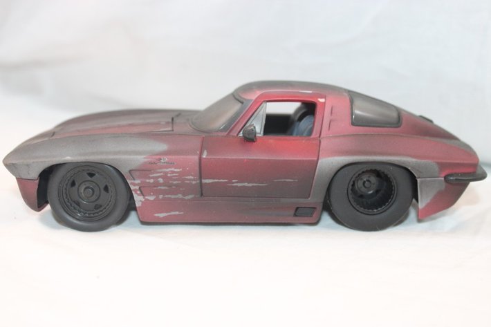 Image for Four 1:24 Scale Diecast Models: Jada 1968 Chevy Corvette Stingray Coupe, Jada 1967 Chevy Impala SS Cardinals Themed, 1961 Ford Thunderbird, and Classic Metal Works '64 Impala