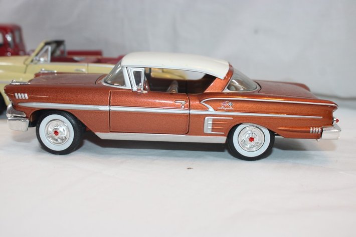 Image for Four 1:24 Scale Diecast Cars: 1939 Chevy Coupe, Classic Metal Works '50s Chevy Impala, Classic Metal Works Mercury Convertible, and Maisto 1950 Chevy 3100