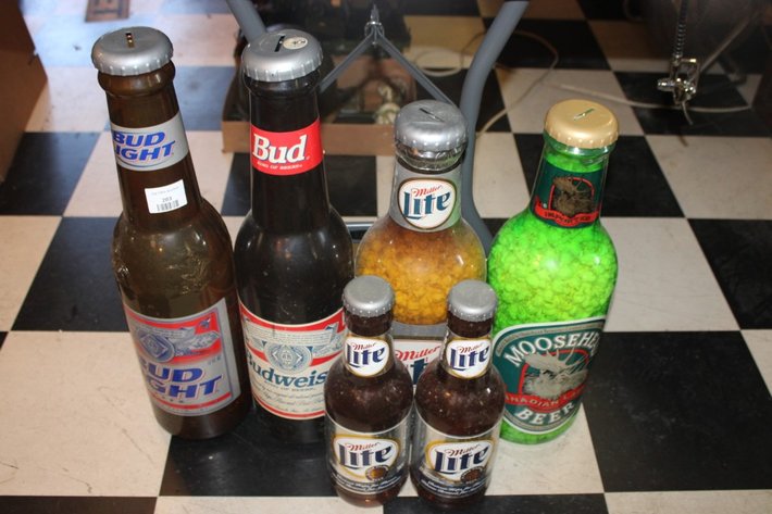 Image for Beer Bottle Coin Banks Ranging from 20 Inches Tall Down to 14 Inches Tall
