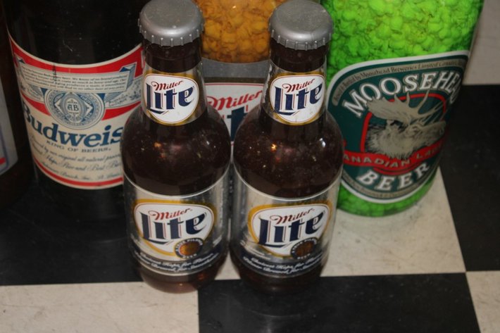 Image for Beer Bottle Coin Banks Ranging from 20 Inches Tall Down to 14 Inches Tall