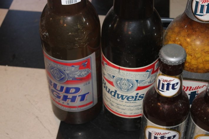 Image for Beer Bottle Coin Banks Ranging from 20 Inches Tall Down to 14 Inches Tall