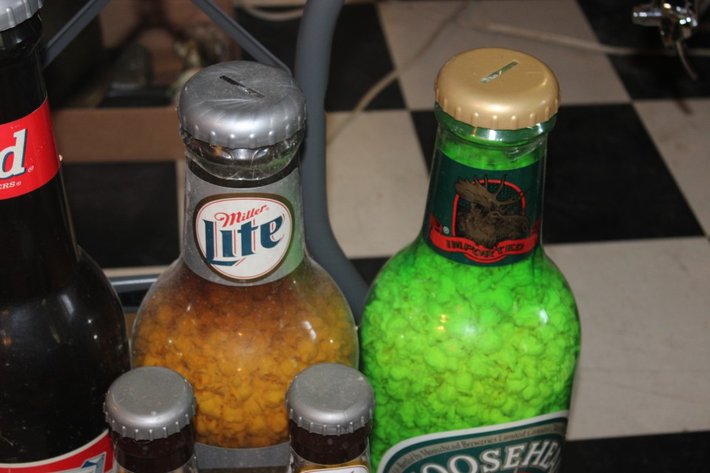 Image for Beer Bottle Coin Banks Ranging from 20 Inches Tall Down to 14 Inches Tall