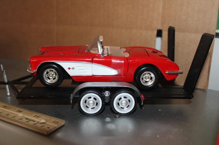 Image for Display Shelf with Two 1:24 Scale Models on Trailers: 1974 AMC Gremlin X and '59 Corvette. Shelf Measures 24 x 11.5 x 11.5
