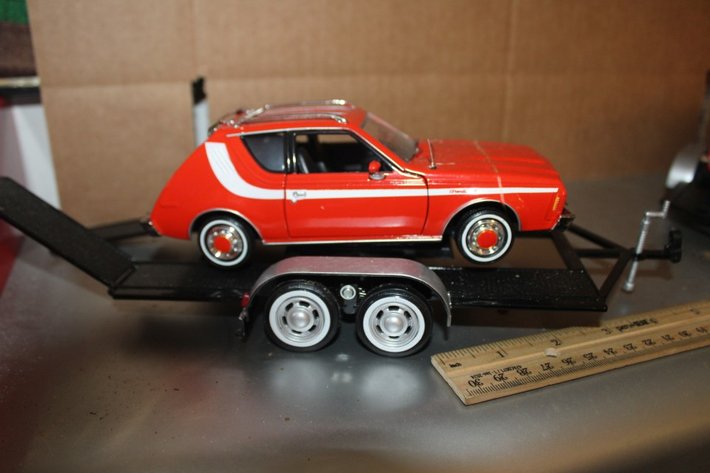 Image for Display Shelf with Two 1:24 Scale Models on Trailers: 1974 AMC Gremlin X and '59 Corvette. Shelf Measures 24 x 11.5 x 11.5