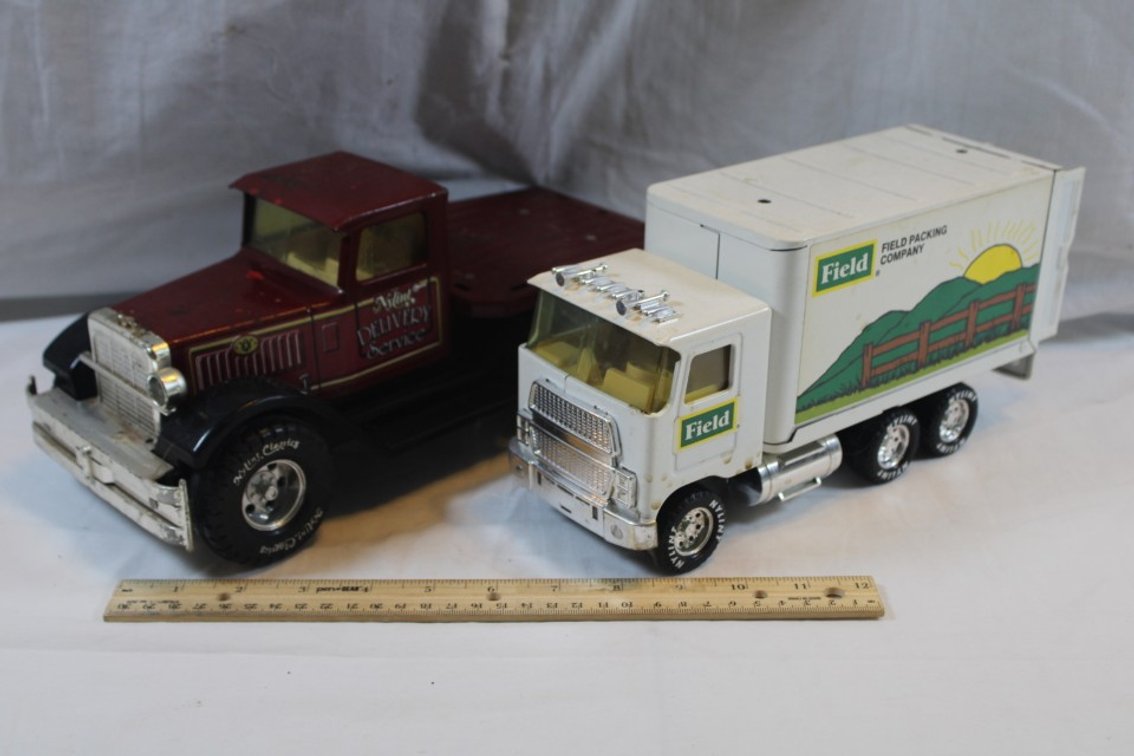 Two Nylint Toy Trucks, One Nylint Delivery Service with Broken Back Bumper and Missing a Headlight and a Nylint Field Packing Company Delivery Truck