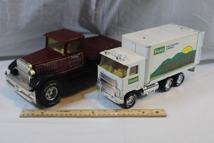 Image for Two Nylint Toy Trucks, One Nylint Delivery Service with Broken Back Bumper and Missing a Headlight and a Nylint Field Packing Company Delivery Truck