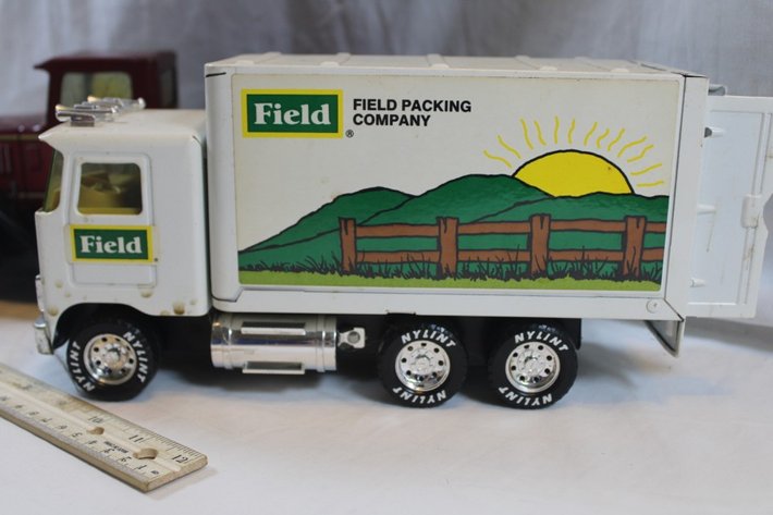 Image for Two Nylint Toy Trucks, One Nylint Delivery Service with Broken Back Bumper and Missing a Headlight and a Nylint Field Packing Company Delivery Truck