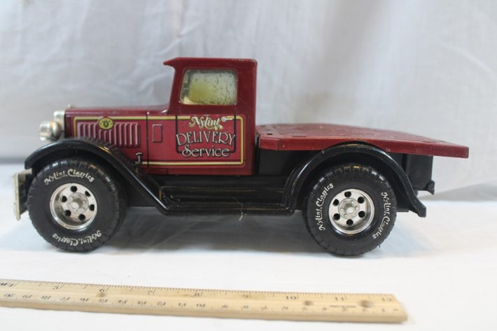Image for Two Nylint Toy Trucks, One Nylint Delivery Service with Broken Back Bumper and Missing a Headlight and a Nylint Field Packing Company Delivery Truck
