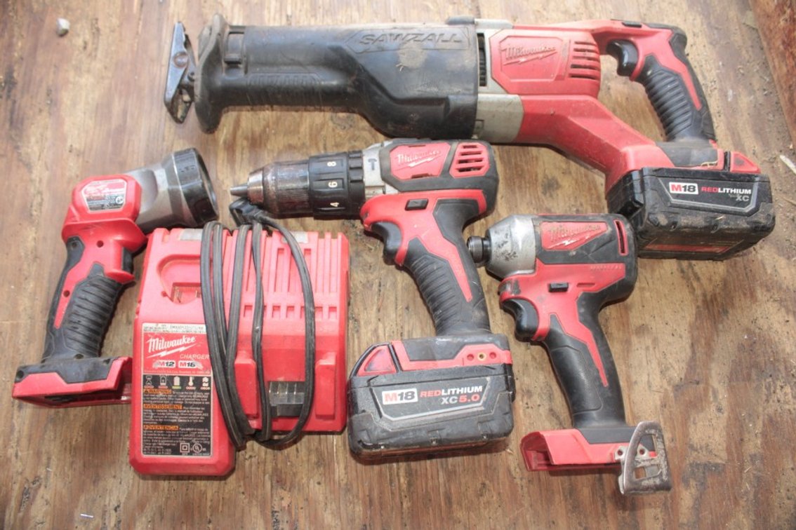 Milwaukee M18 Sawzall, Drill, Impact and Flashlight Has 2 Batteries and an M12 M18 Charger