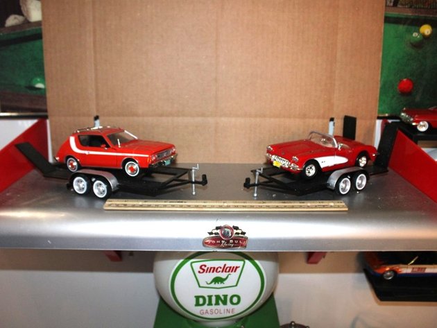 Image for Display Shelf with Two 1:24 Scale Models on Trailers: 1974 AMC Gremlin X and '59 Corvette. Shelf Measures 24 x 11.5 x 11.5