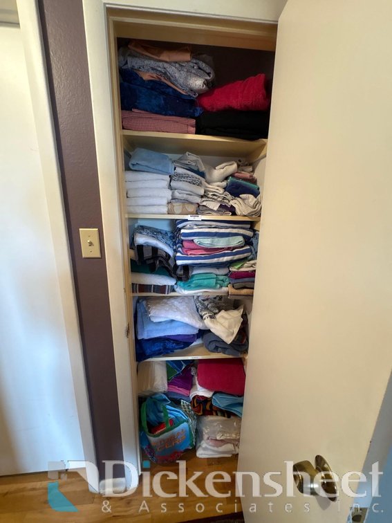 LOT OF LINENS IN CLOSET