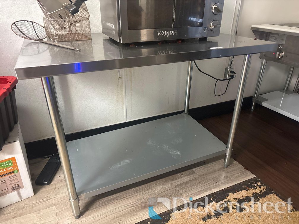 STAINLESS STEEL TABLE WITH LOWER SHELF ON CASTERS