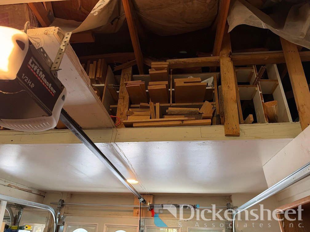 LUMBER ABOVE GARAGE DOOR