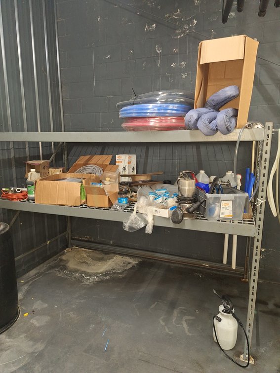 Lot of Plumbing Fittings, Replacement Tubes and Other Various Items with Storage Rack