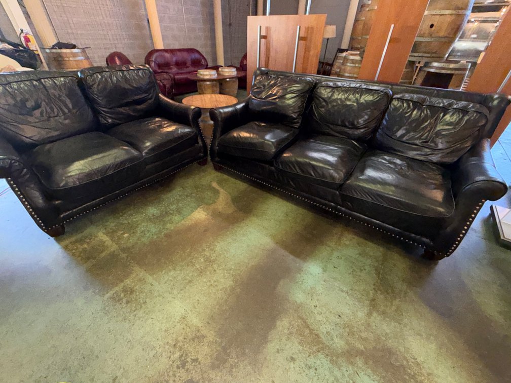 (2) Leather-Style Couches and Table