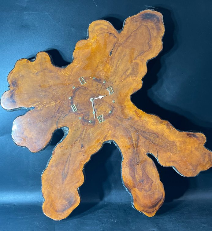 Wood Slab Wall Clock with Roman Numerals and Metal Hands