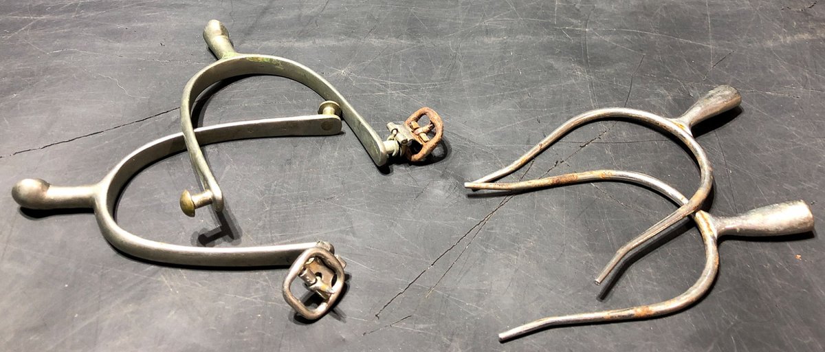 Two Pairs of Metal Riding Spurs One with ‘Never Rust’ Marking