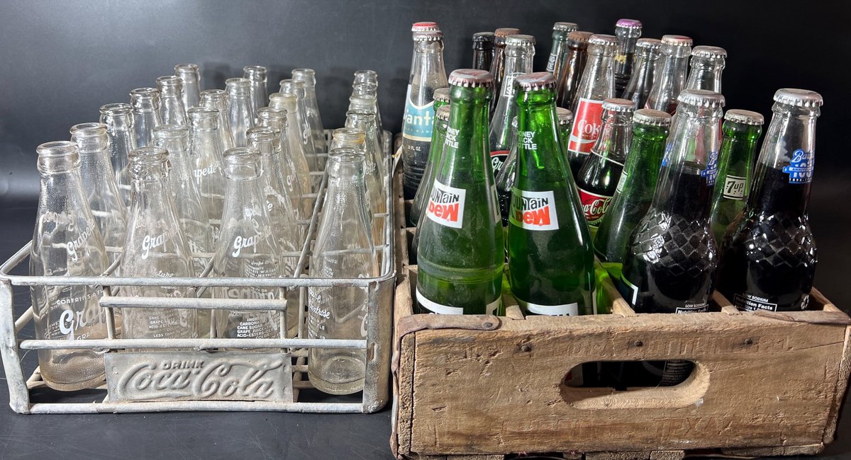 Vintage Soda Bottles with Coca-Cola and Pepsi Crates