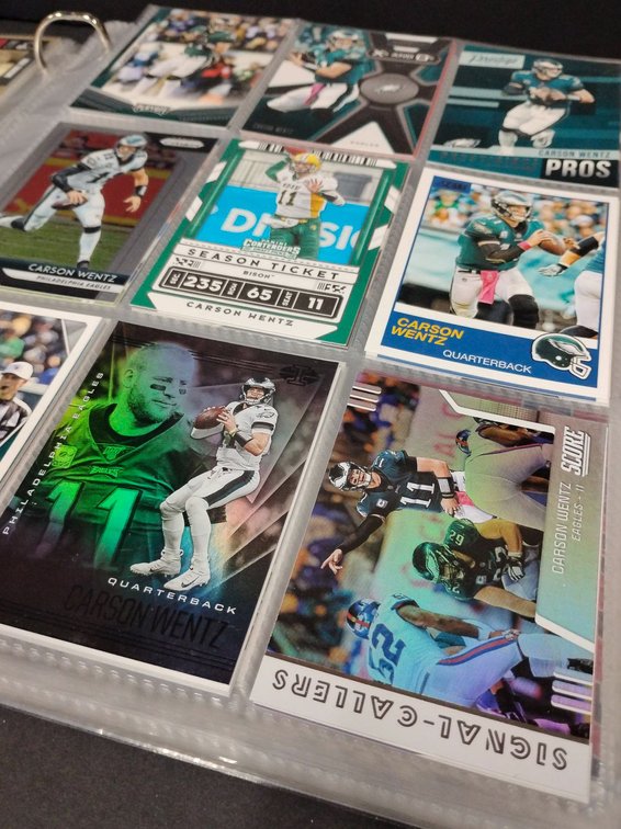 Binder of Football Trading Cards Featuring Various Players and Sets