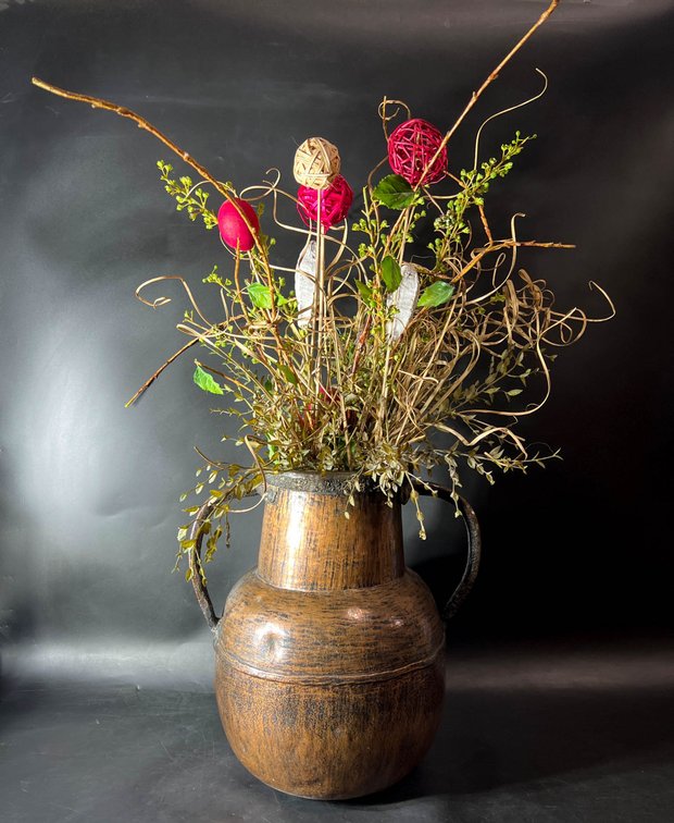 Rustic Wooden Vase With Metal Handles and Floral Arrangement
