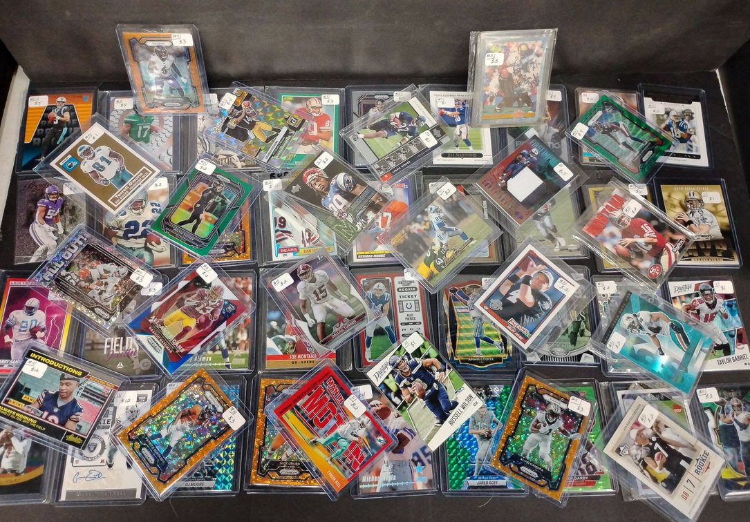56 Football Cards Including Manning, Montana and Sanders