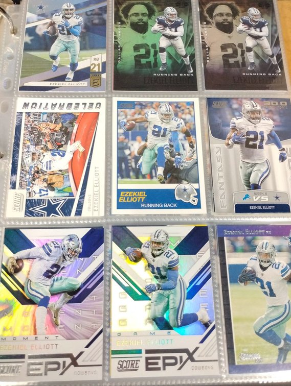 Binder of Dallas Cowboys Football Cards Featuring Various Players