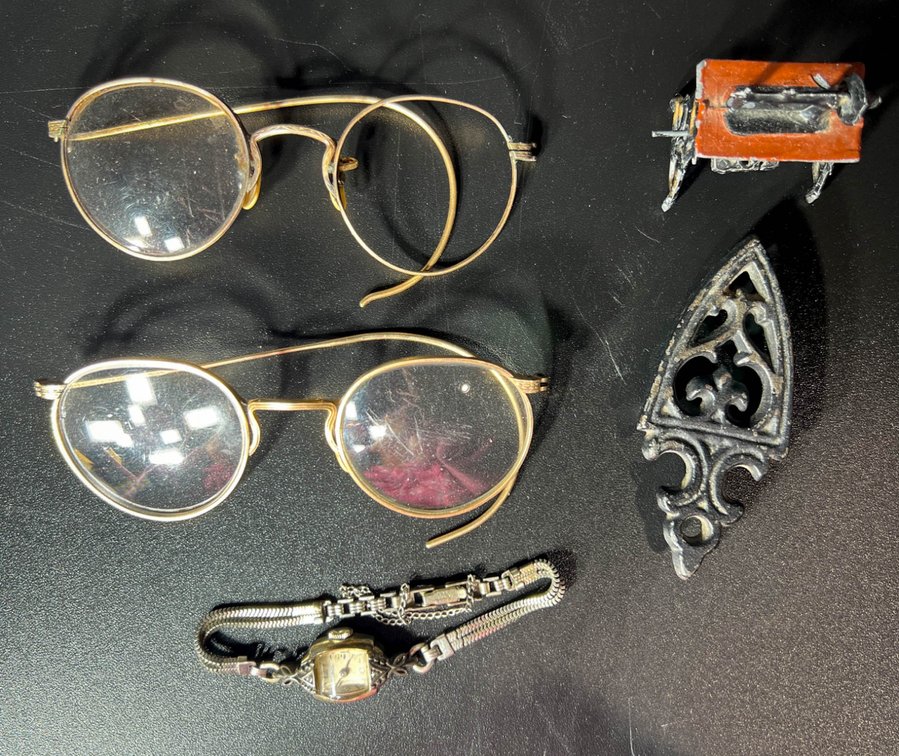 Eyeglasses, Watch, Cast Iron Piece, and Miniature Sewing Machine