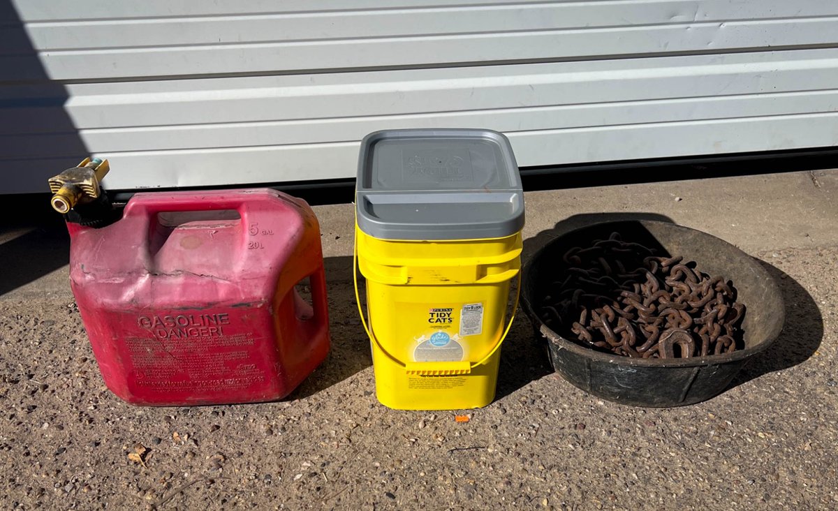 Cat Litter, Red Gasoline Can, and Metal Chain in Bowl