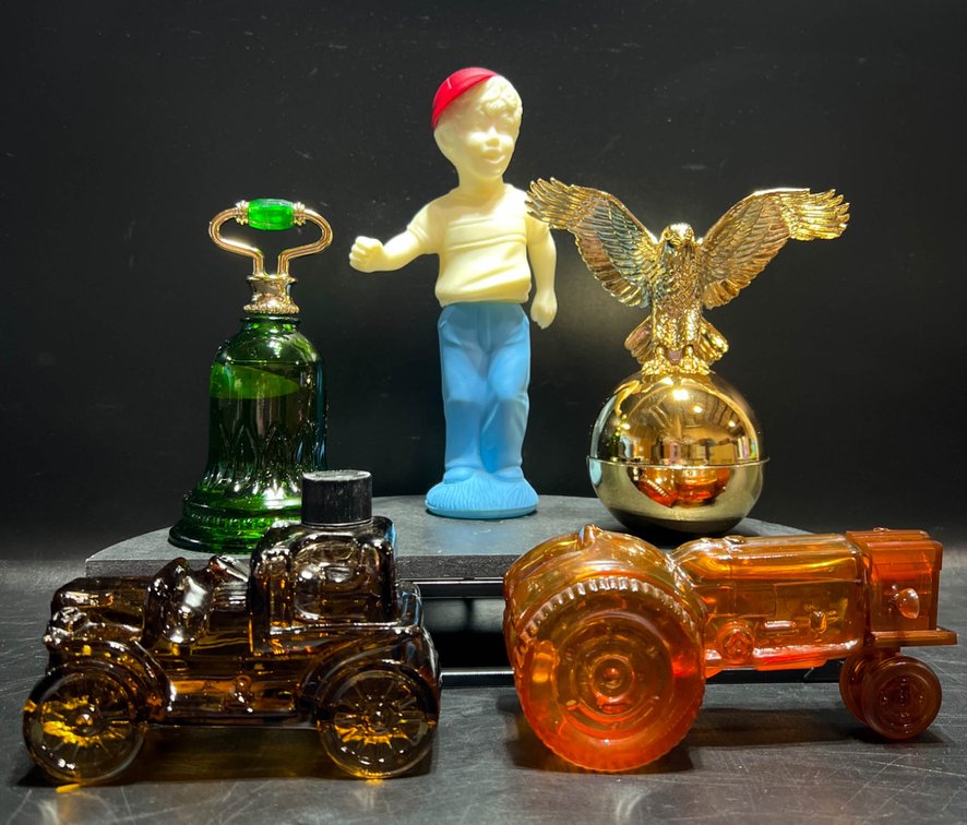 Avon Glass Bottles Featuring Decorative Designs